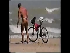 men in thong on the beach