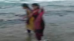 Lesbias enjoying at beach