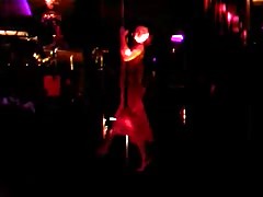 Slender stripper is dancing on shaft and playing with her body